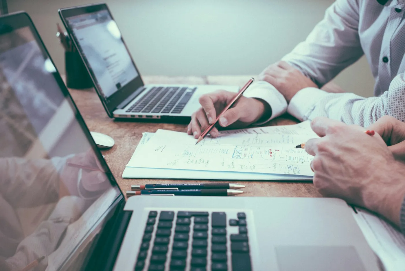 Business owner reviewing charts and revenue numbers at a desk